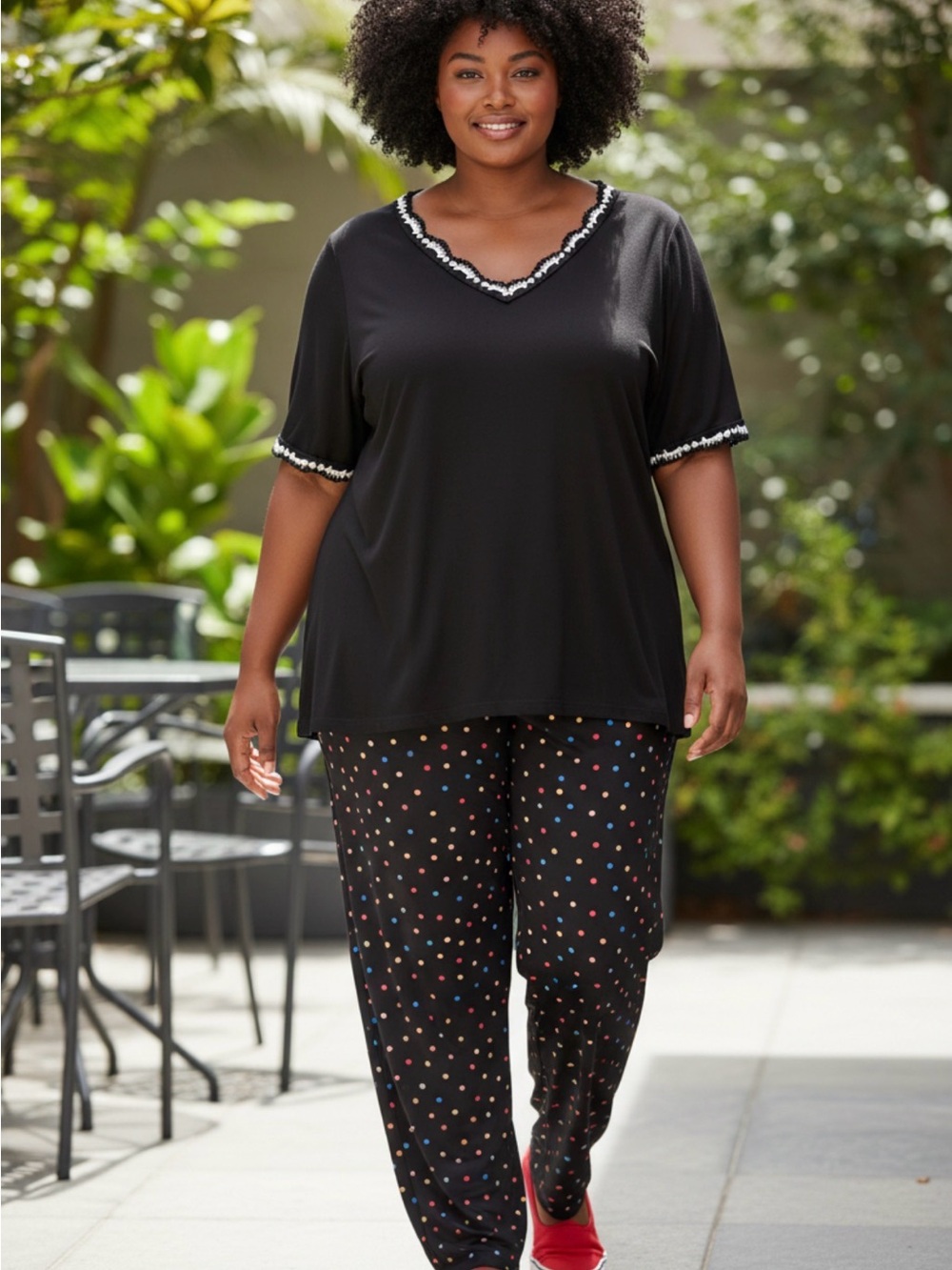 NWT: size 14/16 (2 piece’s ) Black colorful Polka Dot pants paired with a top.